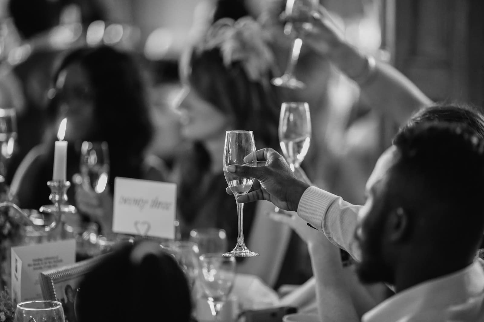 Guests raising a toast at a fundraising dinner